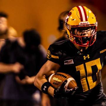 Mission Viejo's Jordan Hicks runs with the ball in a game against Folsom earlier this year. 
