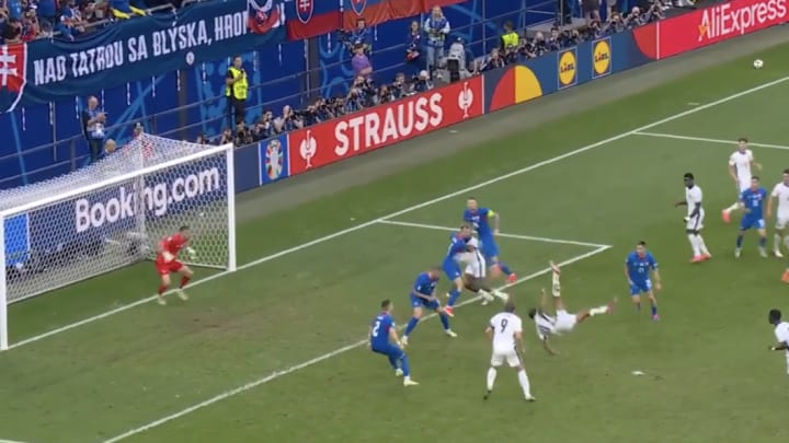 Jude Bellingham scores a bicycle kick for England in the 95th minute vs. Slovakia at Euro 2024.