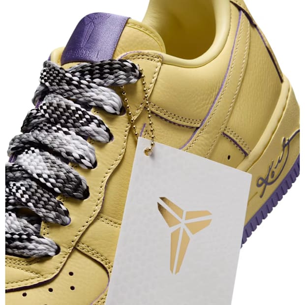 Details on yellow Nike Air Force 1 sneakers.