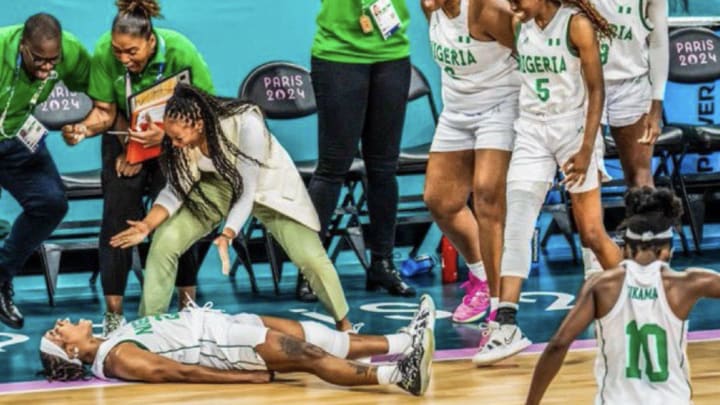 The Nigeria women's basketball team celebrates on the court at Pierre Mauroy Stadium after its 75-62 win over Australia at the Olympics in Paris on Monday, July 29, 2024. 