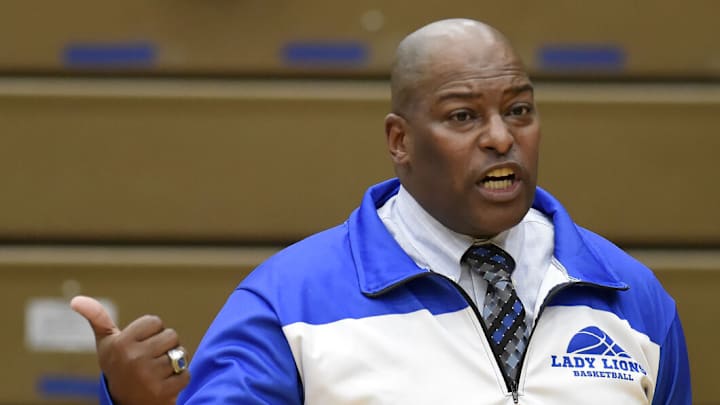 Will Coatie looks on during an Elkhart basketball game. Will Coatie looks on during an Elkhart basketball game.