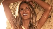 Jena Sims was photographed by Ben Watts in Bermuda. Swimsuit by SAME. Cuff by Ettika.