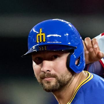 Seattle Mariners catcher Cal Raleigh (29) and Texas Rangers second baseman Marcus Semien (2) look to first on a double play attempt during the sixth inning at T-Mobile Park on Aug. 1. 