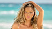 Ellie Thumann was photographed by Yu Tsai in Mexico. Swimsuit top by Nué Studio. Swimsuit bottom by Oséree. 