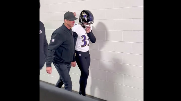 Tyler Loop and John Harbaugh walk to the locker room after a loss to the Steelers.