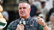 Michigan State's new football coach Pat Fitzgerald addresses the crowd during a timeout in the first half of the Spartans basketball game against Iowa on Tuesday, Dec. 2, 2025, at the Breslin Center in East Lansing.