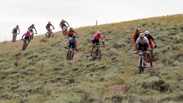 Mountain bike racers riding down a mountain