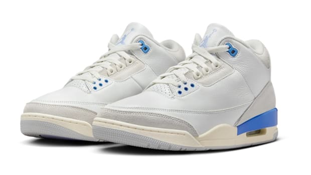 White and blue Air Jordan sneakers.