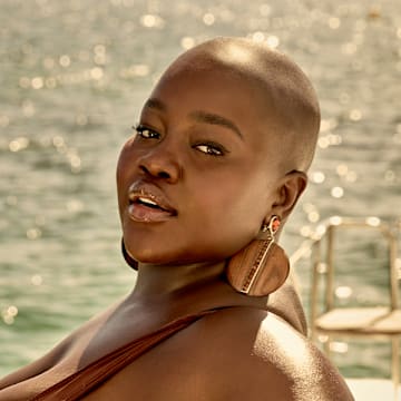 Achieng Agutu was photographed by Yu Tsai in Mexico. Swimsuit by BFYNE. Earrings by YSL provided by New York Vintage. Bracelets from Amazon.