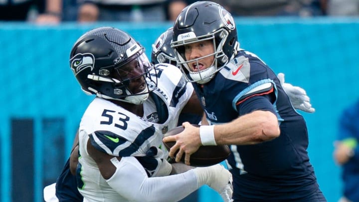 Seattle Seahawks linebacker Boye Mafe (53) tackles Tennessee Titans quarterback Ryan Tannehill (17) late in the fourth quarter during their game at Nissan Stadium in Nashville, Tenn., Sunday, Dec. 24, 2023. The Tennessee Titans were unable to make a comeback as the clock ran out and they lost 20-17.