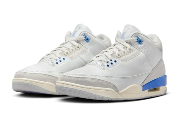 White and blue Air Jordan sneakers.