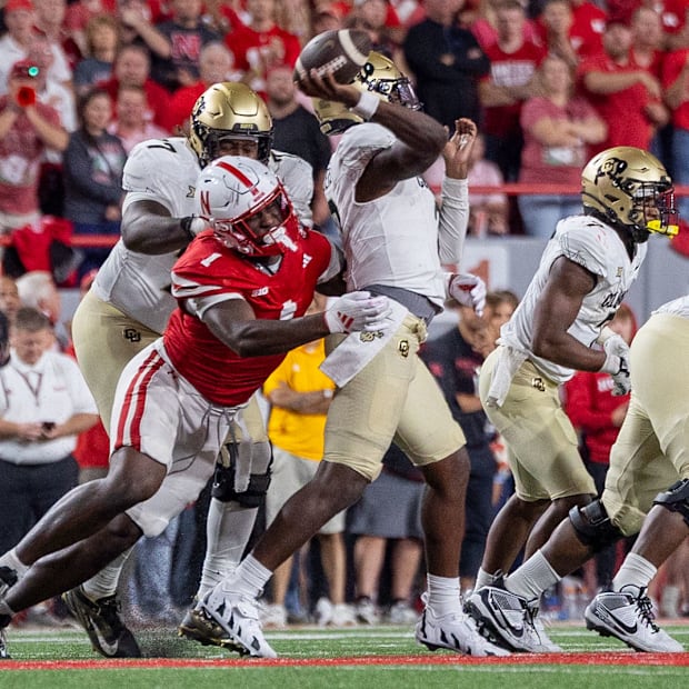 Nebraska defensive lineman Jimari Butler pressures Colorado's Shedeur Sanders in the fourth quarter.