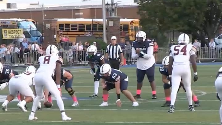 Kyren Eleby, St. Louis University High School's 285-pound quarterback, prepares to take a snap against De Smet.