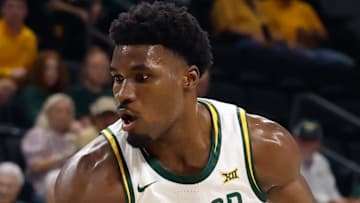 Nov 14, 2025; Waco, Texas, USA; Baylor Bears guard Tounde Yessoufou (24) controls the ball as Tarleton State Texans guard Jordan Mizell (0) defends during the first half at Paul and Alejandra Foster Pavilion. Mandatory Credit: Chris Jones-Imagn Images