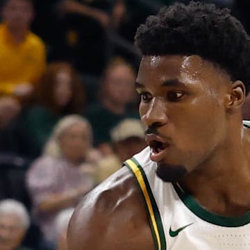Nov 14, 2025; Waco, Texas, USA; Baylor Bears guard Tounde Yessoufou (24) controls the ball as Tarleton State Texans guard Jordan Mizell (0) defends during the first half at Paul and Alejandra Foster Pavilion. Mandatory Credit: Chris Jones-Imagn Images