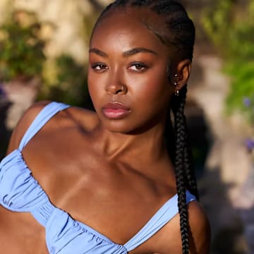 Rayniah Jones was photographed by Taylor Ballantyne. Swimsuit by Faithfull the Brand.