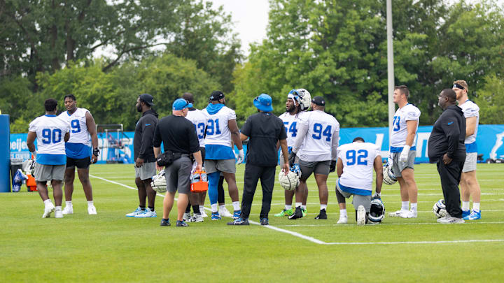 Detroit Lions defense talks during training camp practice.