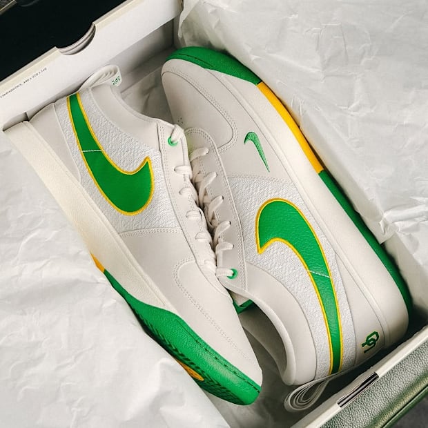 Devin Booker's white and green Nike sneakers.