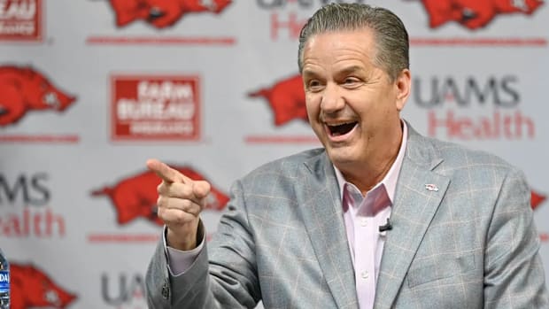 Arkansas Razorbacks coach John Calipari entertains media members during his introductory press conference.