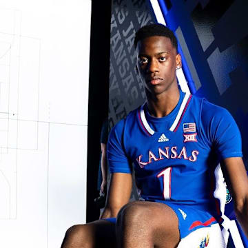 AJ Dybantsa donning a Kansas Uniform during his official visit.