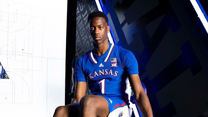 AJ Dybantsa donning a Kansas Uniform during his official visit.