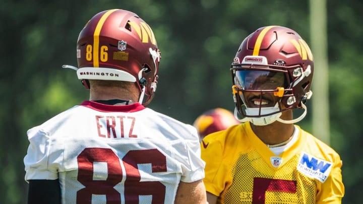 Washington Commanders tight end Zach Ertz (left) and quarterback Jayden Daniels.