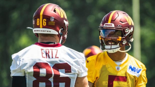 Washington Commanders tight end Zach Ertz (left) and quarterback Jayden Daniels.