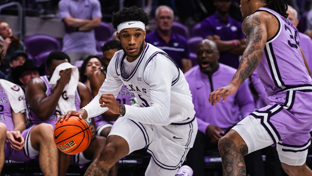 Micah Robinson drives the ball in a 84-82 TCU win over Kansas State on Saturday, February 7, 2026.