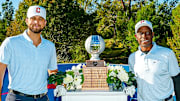 Slade Cecconi and Kenny Lofton pose with the trophy at the inaugural Capital One MLB Open