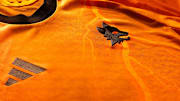 Roma's new away kit is orange.