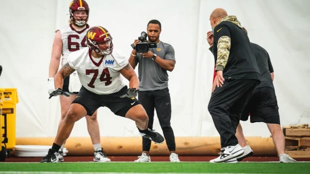 Washington Commanders offensive tackle works out with position coach Bobby Johnson