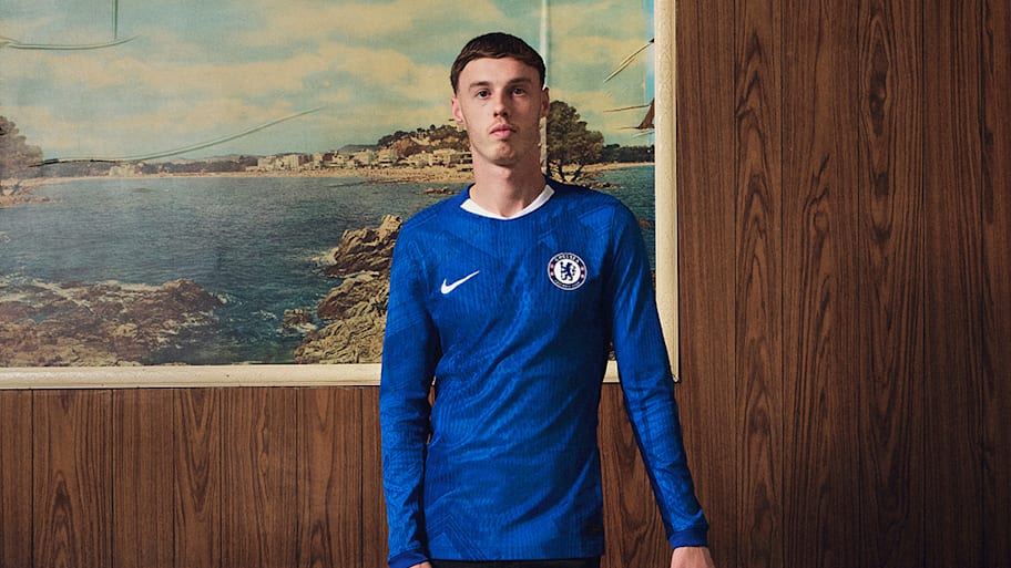 Cole Palmer posing in the new Chelsea home kit for 2025/26