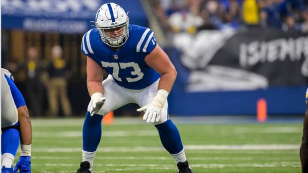 Indianapolis Colts tackle Blake Freeland (blue uniform with white pants/helmet) gets ready to block for his quarterback. 