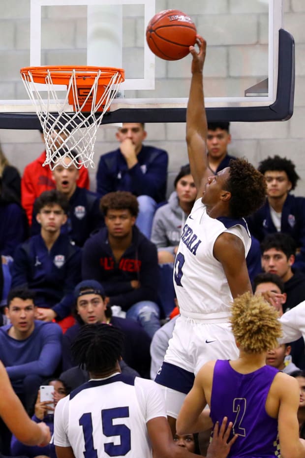 Bronny James skies for a one-handed dunk during his freshman season of 2019-20.