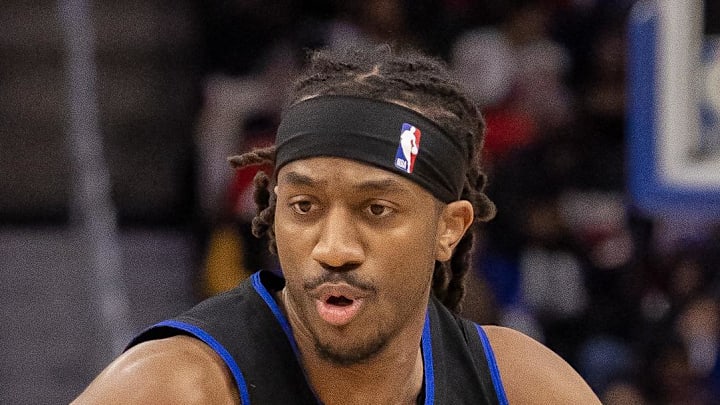 Detroit Pistons guard Daniss Jenkins (24) moves the ball up court against the Houston Rockets during the second half at Little Caesars Arena on Jan 23, 2026.