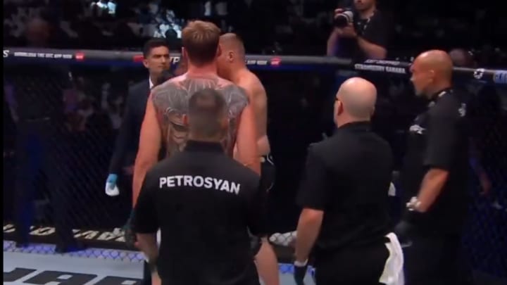 Sergei Pavlovich shoves Alexander Volkov following his unanimous decision loss at UFC Fight Night in Saudi Arabia.