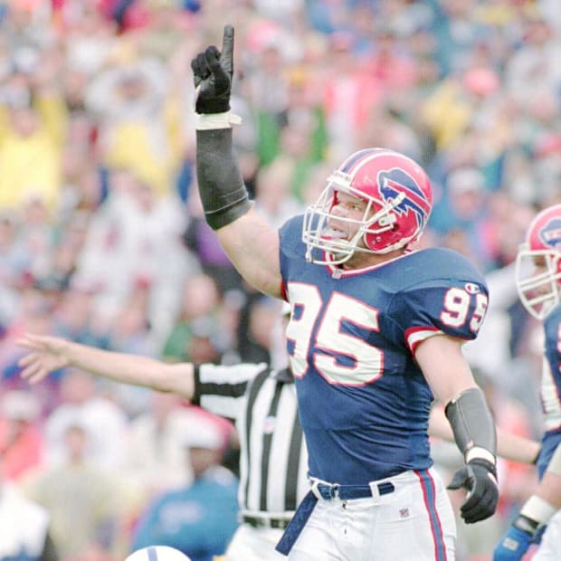 Former Buffalo Bills linebacker Bryce Paup celebrates a sack against the Colts quarterback.
