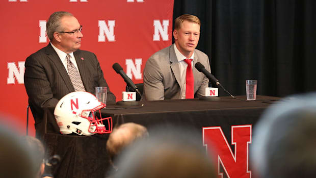 Bill Moos and Scott Frost at press conference announcing Frost's hiring.