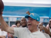 Harbaugh celebrating in the Los Angeles Chargers locker room after the Week 1 win against the Las Vegas Raiders