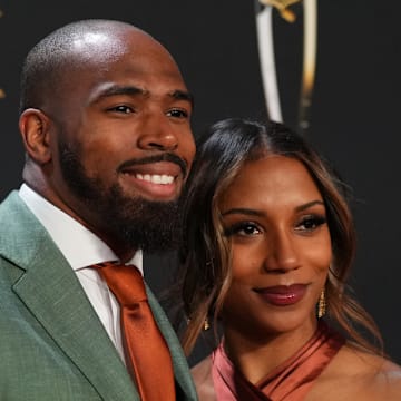 Chuck Clark and Aysha Clark on the red carpet during the 2023 NFL Honors
