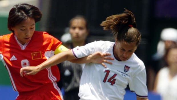 The USA's Joy Fawcett tries to keep China's Sun Wen from the ball during 1st half action in the 1999 Women's World Cup final.