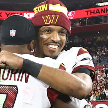 Jan 12, 2025; Tampa, Florida, USA; Washington Commanders quarterback Jayden Daniels (5) celebrates with wide receiver Terry McLaurin (17) after winning a NFC wild card playoff against the Tampa Bay Buccaneers at Raymond James Stadium. Mandatory Credit: Kim Klement Neitzel-Imagn Images