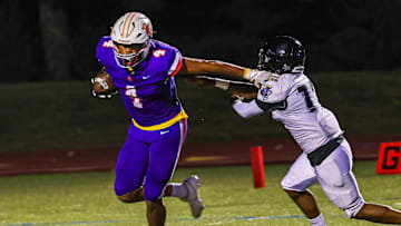 2026 prospect Demeterius Thompson (4) sheds a tackler on a rush attempt. 