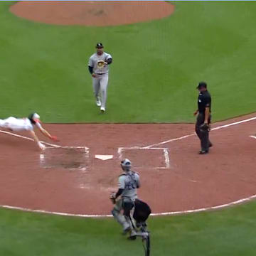 Baltimore Orioles SS Gunnar Henderson scores a run against the Colorado Rockies after a wild pitch from Jaden Hill.