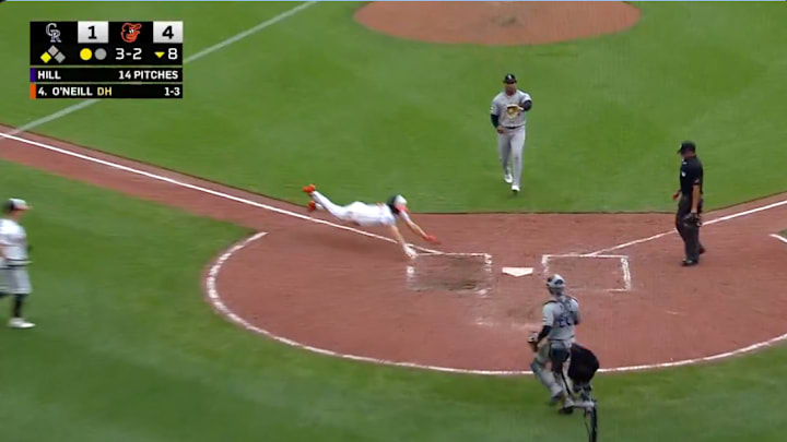 Baltimore Orioles SS Gunnar Henderson scores a run against the Colorado Rockies after a wild pitch from Jaden Hill.