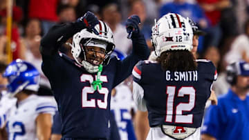 Oct 11, 2025; Tucson, Arizona, USA; Arizona Wildcats defensive backs Michael Dansby (25) and Genesis Smith (12) both celebrate during the fourth quarter of the game against the Brigham Young Cougars at Arizona Stadium. Mandatory Credit: Aryanna Frank-Imagn Images