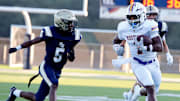 Plum's C.J. Hart carries the ball during the Mustangs' season-opening win over Franklin Regional in August. The Mustangs won a wild game against rival Penn Hills Friday night to put themselves in position for a WPIAL Class 5A wild card.