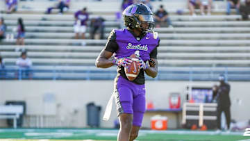 London Smith warming up before a matchup early this season. 