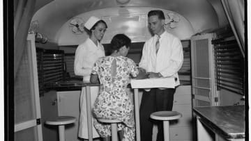 A young woman gets tested for syphilis in a "trailer-laboratory" in Washington, D.C. in 1937.
