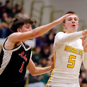 Forest Hills' Dylan Stohon, right, fires a pass away from Mohawk's Bobby Fadden during the second round of the PIAA Class 3A playoffs at Gateway High School in Monroeville. Stohon, a junior who has already scored 1,000 points, help the Rangers make the state quarterfinals for the first time in their history last season.